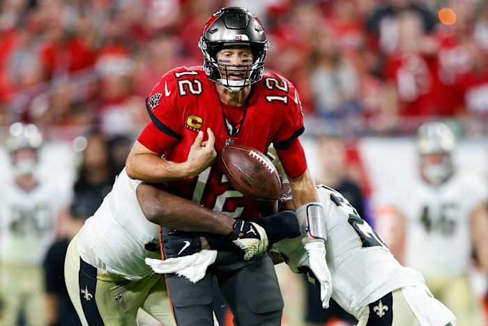 Tampa Bay Buccaneers quarterback Tom Brady (12) fumbles the ball in the second half against the New Orleans Saints at Raymond James Stadium.